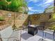 A cozy backyard setup with comfortable seating, a fire pit, and a decorative privacy fence, perfect for outdoor gatherings at 246 22Nd Ne Ave, St Petersburg, FL 33704