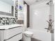 Tastefully updated bathroom featuring modern fixtures and tiled tub-shower at 246 22Nd Ne Ave, St Petersburg, FL 33704