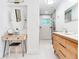 Bright bathroom features a modern vanity and glass-door shower at 246 22Nd Ne Ave, St Petersburg, FL 33704
