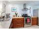 Modern kitchen featuring stainless steel appliances, wood cabinets and countertops, and ample counter space at 246 22Nd Ne Ave, St Petersburg, FL 33704