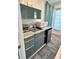 Efficient kitchenette equipped with modern appliances and stylish cabinetry, maximizing space and functionality for convenient meal prep at 246 22Nd Ne Ave, St Petersburg, FL 33704