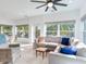 Spacious living room features a large sectional sofa, tile floors, and bright, natural light at 246 22Nd Ne Ave, St Petersburg, FL 33704