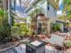 A delightful patio is adorned with lush plants, a spiral staircase, and comfortable seating, making it an ideal outdoor space at 246 22Nd Ne Ave, St Petersburg, FL 33704