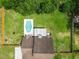 This aerial view showcases the property with a pool, patio, expansive yard, and well-maintained fence at 2512 Rustic Oaks Dr, Lutz, FL 33559