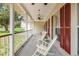 Charming front porch with cozy seating and inviting curb appeal at 2512 Rustic Oaks Dr, Lutz, FL 33559
