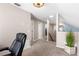 Well lit upstairs hallway with neutral tones at 2512 Rustic Oaks Dr, Lutz, FL 33559