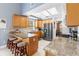 Bright kitchen with stainless steel appliances, granite countertops, tile backsplash and skylight at 2512 Rustic Oaks Dr, Lutz, FL 33559