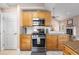 Cozy kitchen with stainless steel oven and granite countertops, with adjacent breakfast area at 2512 Rustic Oaks Dr, Lutz, FL 33559