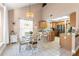 Bright kitchen and dining area with stainless steel appliances and tile flooring at 2512 Rustic Oaks Dr, Lutz, FL 33559