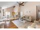Open-concept living room showcasing the kitchen and dining area with lots of natural light at 2512 Rustic Oaks Dr, Lutz, FL 33559