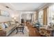 Inviting living room with hardwood floors, comfortable seating, and elegant decor at 2512 Rustic Oaks Dr, Lutz, FL 33559