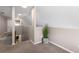 Loft area with neutral paint and carpet, offering an open view to the downstairs living area at 2512 Rustic Oaks Dr, Lutz, FL 33559