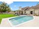 Outdoor shot of a pool and an outdoor patio at 2512 Rustic Oaks Dr, Lutz, FL 33559