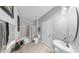 Bathroom features tile floors, neutral paint, shower with tub, and modern sink at 2517 Cumberland Cliff Dr, Ruskin, FL 33570