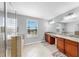 Spacious bathroom featuring a walk-in shower, soaking tub, granite countertops, and double sinks at 2517 Cumberland Cliff Dr, Ruskin, FL 33570