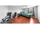 Bedroom with laminate floors, closet, desk, and a window providing natural light and views at 2517 Cumberland Cliff Dr, Ruskin, FL 33570