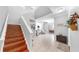 Home entryway featuring wood stairs, tile floors, neutral paint, and views of the dining and living rooms at 2517 Cumberland Cliff Dr, Ruskin, FL 33570