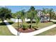 Landscaped front yard with well-maintained lawn, sidewalk and shade trees at 2517 Cumberland Cliff Dr, Ruskin, FL 33570