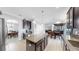 Well-equipped kitchen with stainless steel appliances, center island, and seamless flow to dining area at 2517 Cumberland Cliff Dr, Ruskin, FL 33570