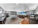 Spacious living room with projector, ping pong table, dual monitors, and lots of room for entertaining at 2517 Cumberland Cliff Dr, Ruskin, FL 33570