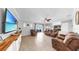 Spacious living room features neutral paint, tile floors, and a ceiling fan at 2517 Cumberland Cliff Dr, Ruskin, FL 33570