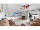 Spacious living room features neutral paint, tile floors, ceiling fan, and access to pool via sliding doors at 2517 Cumberland Cliff Dr, Ruskin, FL 33570