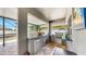 Outdoor kitchen has stainless appliances, mini fridge, and a granite countertop bar at 2517 Cumberland Cliff Dr, Ruskin, FL 33570