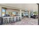 Spacious outdoor kitchen with granite countertops, bar seating, and a grill at 2517 Cumberland Cliff Dr, Ruskin, FL 33570