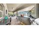 A covered outdoor kitchen and bar area overlook the screened in pool at 2517 Cumberland Cliff Dr, Ruskin, FL 33570