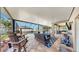 Undercover patio and outdoor kitchen adjoin a screened in pool and outdoor living area at 2517 Cumberland Cliff Dr, Ruskin, FL 33570