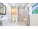 Bright bathroom with walk-in shower and neutral tile at 2675 Firestone Dr, Clearwater, FL 33761