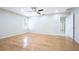 Bedroom with hardwood floors, a ceiling fan, and natural light at 2675 Firestone Dr, Clearwater, FL 33761