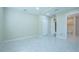 Bedroom with tile floor and an attached bathroom at 2675 Firestone Dr, Clearwater, FL 33761