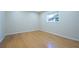 Bright bedroom features hardwood flooring and natural light from window at 2675 Firestone Dr, Clearwater, FL 33761