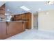 Kitchen featuring an island, stainless steel appliances, modern lighting and tile floors at 2675 Firestone Dr, Clearwater, FL 33761