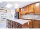 Kitchen featuring an island, double oven, stainless steel appliances and ample cabinet storage at 2675 Firestone Dr, Clearwater, FL 33761