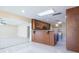 Open kitchen concept with breakfast bar, wood cabinets, stone counters, and stainless oven at 2675 Firestone Dr, Clearwater, FL 33761