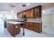 Gourmet kitchen featuring a large island, stainless steel appliances and custom cabinetry at 2675 Firestone Dr, Clearwater, FL 33761