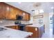 Gourmet kitchen featuring a large island, stainless steel appliances and custom cabinetry at 2675 Firestone Dr, Clearwater, FL 33761