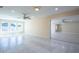 Spacious living room has a ceiling fan, tiled floors, and great natural light at 2675 Firestone Dr, Clearwater, FL 33761