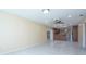 Bright living room boasts stylish ceiling fans, tiled floors and lots of natural sunlight at 2675 Firestone Dr, Clearwater, FL 33761