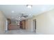 Living room features tiled floors and an open floor plan to the kitchen and other living spaces at 2675 Firestone Dr, Clearwater, FL 33761