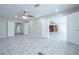 Open living room with tile flooring and plenty of natural light at 2675 Firestone Dr, Clearwater, FL 33761