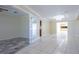 Inviting living room with tile floors, a chandelier, and easy access to other living spaces at 2675 Firestone Dr, Clearwater, FL 33761