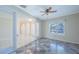 Cozy living room with tile floors, a ceiling fan, and natural light from a window at 2675 Firestone Dr, Clearwater, FL 33761