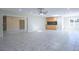 Spacious area featuring tile floors, recessed lighting, wet bar, and open floor plan at 2675 Firestone Dr, Clearwater, FL 33761
