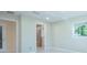 Spacious bedroom with a view of the attached bathroom at 2675 Firestone Dr, Clearwater, FL 33761