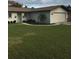 Charming single-story home featuring a well-maintained lawn and inviting curb appeal at 3115 Winchester Dr, Dunedin, FL 34698