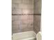 Newly renovated shower with stone tile, mosaic accents, and modern fixtures at 3115 Winchester Dr, Dunedin, FL 34698