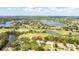 Aerial view showcases the property's lush green surroundings, its location, and proximity to the lake at 3130 Walnut Ne St, St Petersburg, FL 33704